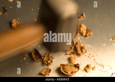Sledge Hammer Cracking Nuts Stock Photo