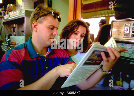 Couple age 27 ordering breakfast at Mickey's historic diner. National Register of Historic Places St Paul Minnesota USA Stock Photo