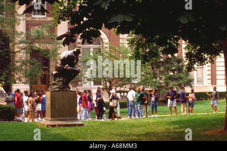 Black high school students passing Rodan's The Thinker on the Columbia University Campus. New York New York USA Stock Photo