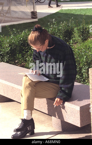 Student age 20 smoking at Biomedical Engineering Building open house. Minneapolis Minnesota USA Stock Photo