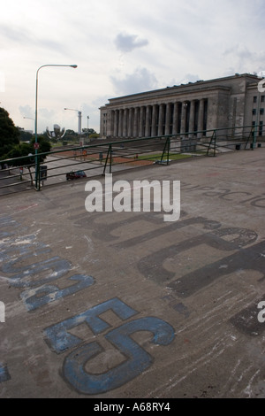 Public building in Buenos Aires viewed across a graffitied footbridge Stock Photo