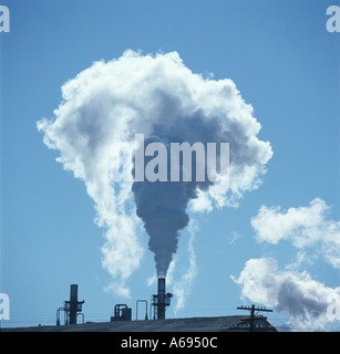 Smoke from a power plant chimney stack Stock Photo
