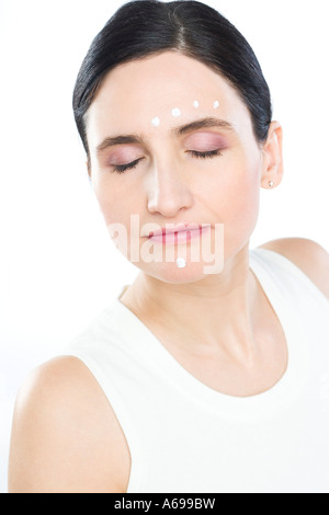 woman creaming face Stock Photo