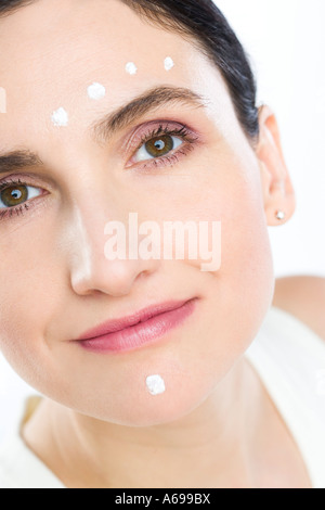 woman creaming face Stock Photo