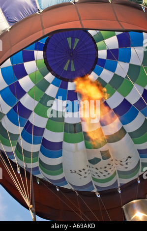 Inflating an air balloon with hot air with help of gas-jet Stock Photo