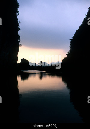 Sunset on the Ngo Dong river at Tam Coc, Near Ninh Binh, Vietnam Stock Photo