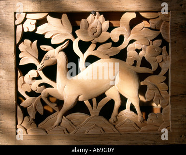 Bhutan Bumthang Valley Jakar crafts Woodcarving deer panel in blue pine Stock Photo