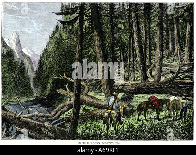Pack train of fur traders in the Rocky Mountains 1800s. Hand-colored woodcut Stock Photo