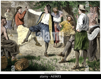 French fur traders and Native Americans dancing at a rendezvous in the north woods. Hand-colored woodcut Stock Photo