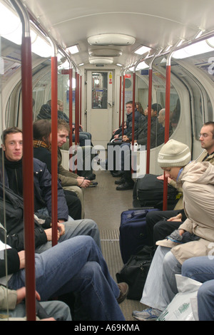 Passengers inside a subway train The Tube London UK Stock Photo