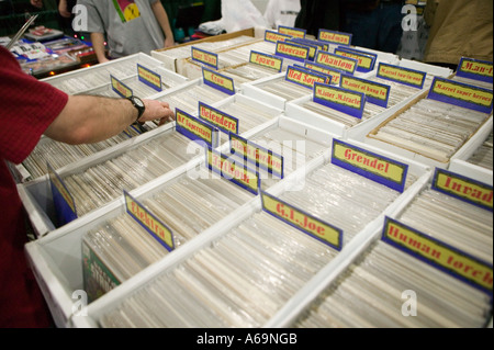 Visitors examine comics on sale at the Comic Con comics convention in New York City 25 February 2006 Stock Photo