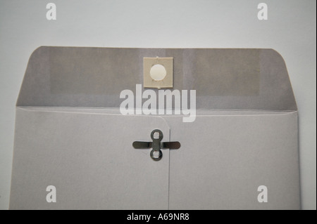 Studio shot of an open plain grey envelope on a white surface 2006 Stock Photo