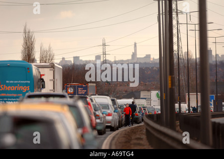 MOTORISTS LEAVE THEIR CARS IN A TRAFFIC JAM FOLLOWING A POLICE INCIDENT ON THE M6 NORTH OF BIRMINGHAM UK Stock Photo