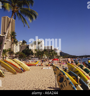 View along Waikiki Beach with surfboards stacked in racks along on the sands Honolulu Oahu Island Hawaii