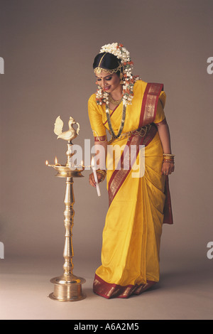 VDA77158 South Indian Bride Dressed In Traditional Bridal Costume Full Figure Lighting A Traditional Lamp MR#119 Stock Photo