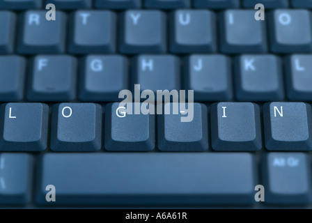 LOG IN on a computer keyboard toned blue Stock Photo