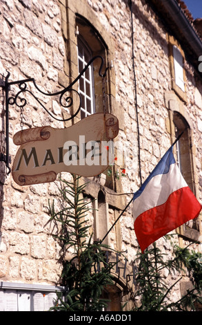 Monpazier Town Hall Mairie sign & French tricolour flag on stone wall in a commune in Dordogne department in Nouvelle-Aquitaine, southwest Franc Stock Photo