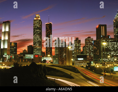 Highways leading into and out of Atlanta at dusk under city skyline Stock Photo