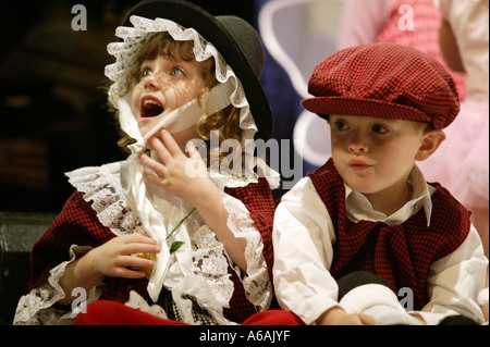 Two children dressed in traditional Welsh costume at the Eisteddfod cultural festival in Bangor Wales Stock Photo