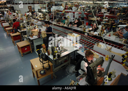 Leather workers on the factory floor at Mulberry in Chilcompton Somerset where the average age is 53 Stock Photo