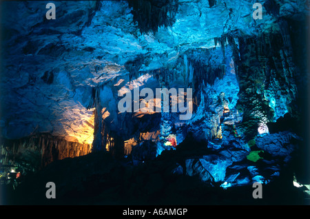 China, Guangxi, Guilin, Guangming Hill, Ludi Yan (Red Flute Cave), colorfully illuminated hall in cave limestone formations Stock Photo