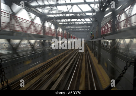 Williamsburg Subway bridge grid metal pillars commuters train station ...