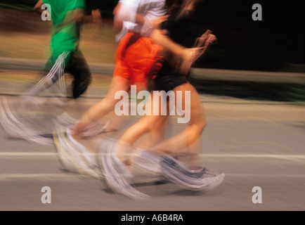 New York Central Park jogging workout. Three joggers running in Manhattan Central Park. Healthy activities for group of people in the park. Stock Photo
