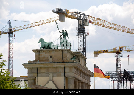 The Brandenburg Gate in Berlin Germany surrounded by cranes Stock Photo