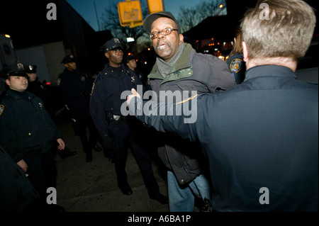 NYPD police officers arrest a man in New York Cty USA Dec 2006 Stock Photo