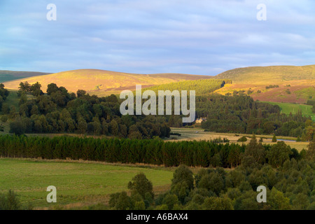 Tomatin scotland view of the fields and hills at sunset with house Stock Photo