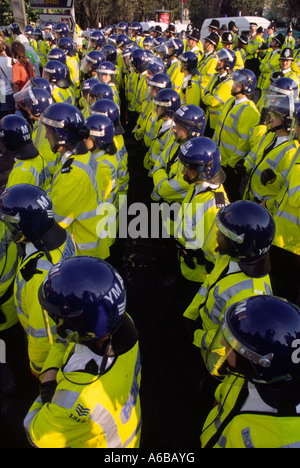 The police at a reclaim the street protest at the g8 summit in birmingham in 1998 with people protesting and being arrested Stock Photo