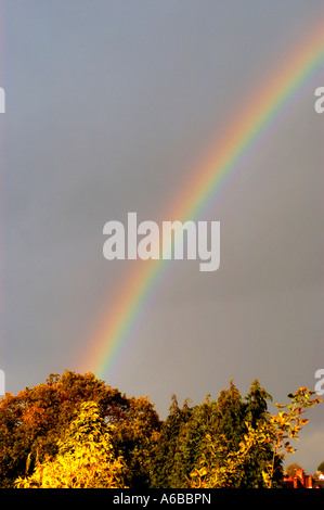 A rainbow over a dark brooding sky in england event events fog bow fog bows fog bow fog bows Light lightning effect Stock Photo