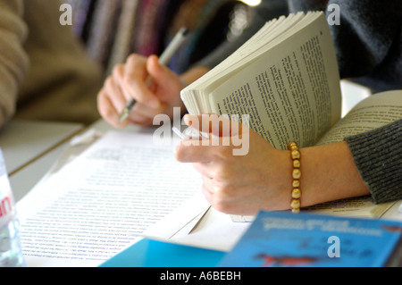 British student revising with text book London college or university UK Stock Photo