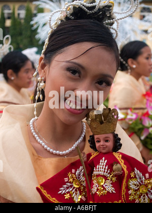 beauty with St Nino doll at the Sinulog Festival Cebu Philippines Stock Photo