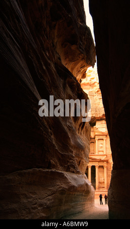 Approaching the Treasury through the narrow gorge called the Siq Petra Jordan Stock Photo