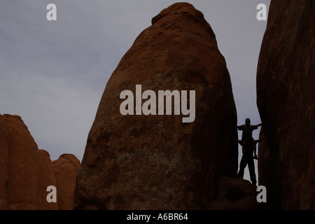 son on fathers shoulders in between sandstone monoliths