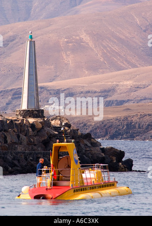 A Submarine Safaris submarine ride leaves from the port of  Puerto Calero on the island of Lanzarote for a view of  lopcal reefs Stock Photo