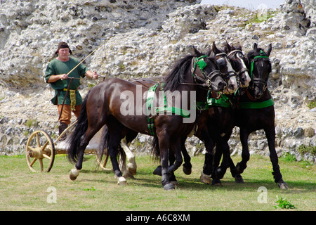 roman chariot and man dressed up as roman warrior being pulled by four horses in Kent, UK Stock Photo