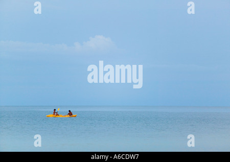 Two Thai young men in a kayak on the Gulf of Thailand Ko Phangnan Phangan Thailand Stock Photo