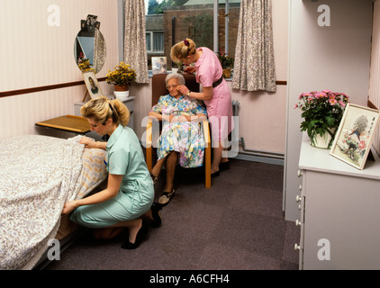 Old Age elderly person carers in sheltered housing room Stock Photo