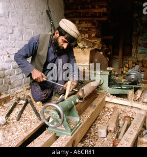 Pakistan Swat Valley Mingora Bazaar crafts woodworker turning chair legs Stock Photo