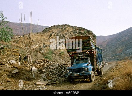 Pakistan Swat Valley decorated truck in hillside quarry near Mingora Stock Photo