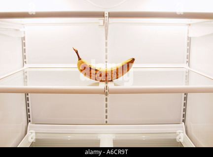 Old Banana in Empty Refrigerator Stock Photo