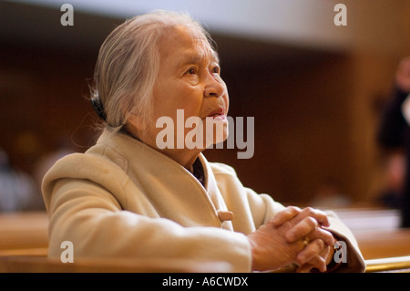 Woman Praying Inside Church Stock Photo