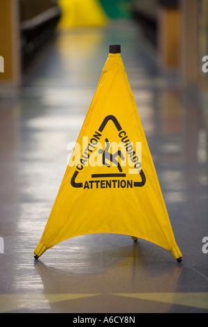 Caution slippery sign without text in tropical surroundings Stock Photo ...