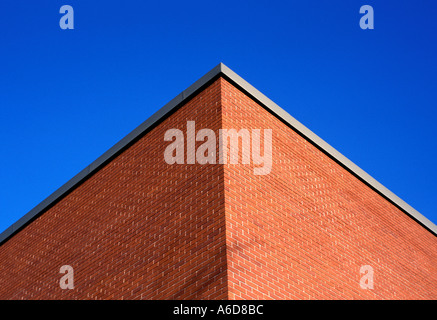 brick wall corner of building with blue sky Stock Photo