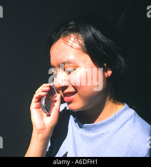 24887 young woman talks on cell phone Stock Photo