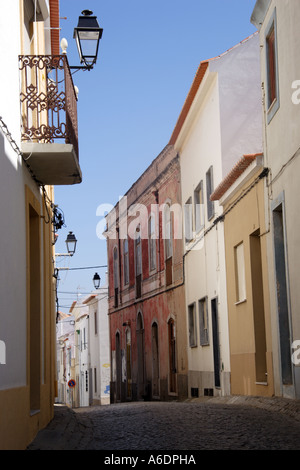 Cobbled back street in the old part of Sines a small coastal fishing town in portugal Stock Photo