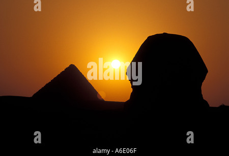 Silhouette of the Giza pyramid at sunset against a blood-red sky, Egypt ...