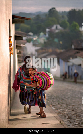 Guatemalan Maya girl turning whilst walking home Chichicastenango El Quiché Guatemala Photo by Jamie Marshall Stock Photo